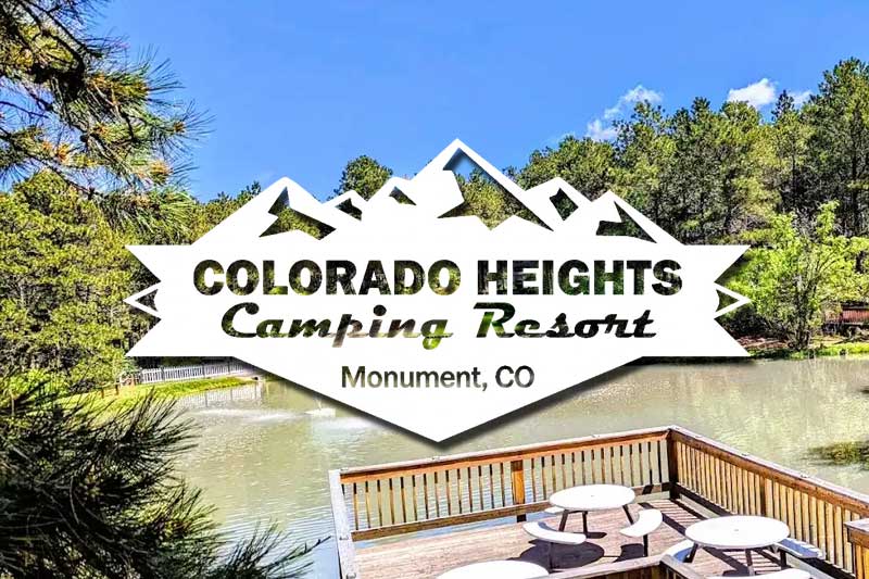 Premium Waterfront Campground Membership Resales A premium travel trailer RV camper neatly set up on a spacious campsite at a secure, wooded waterfront private campground resort.